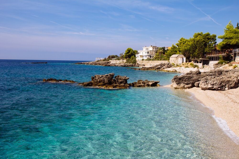 Dhërmi Beach, a gem of the Albanian Riviera with crystal-clear waters and breathtaking landscapes.