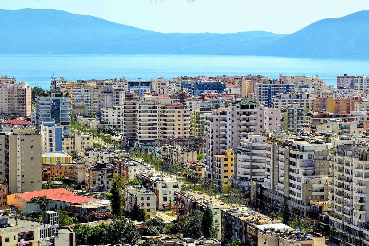 A view of Vlore with modern buildings and the sea in the background